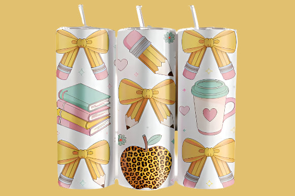 Three cylindrical tumblers with decorative designs on a blurred background