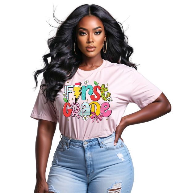 Woman wearing a pink t-shirt with 'First Grade' text and colorful design, standing against a white background.