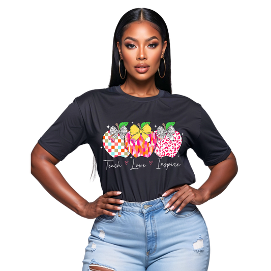 Woman wearing a black t-shirt with colorful graphic design and text on a white background