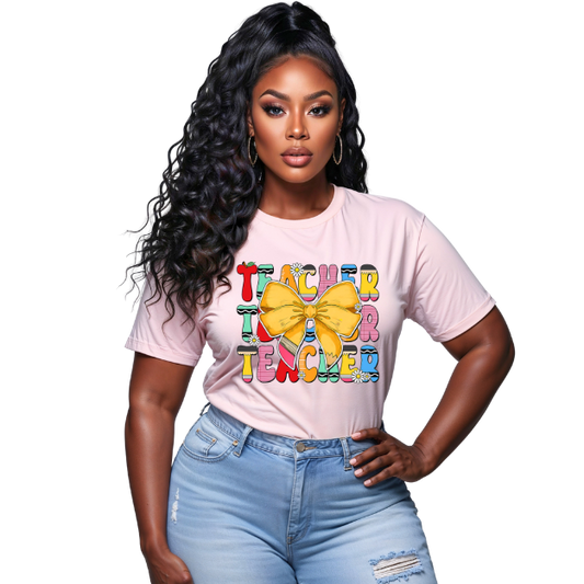 Woman wearing a pink t-shirt with colorful text and a bow graphic on a white background